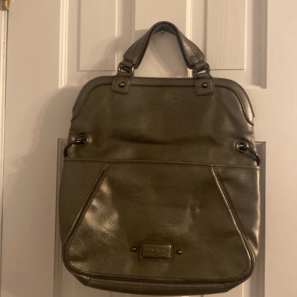 Nine West Gunmetal faux leather handbag with shoulder strap and handle.
